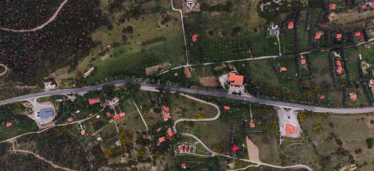Aerial landscape of rural countryside with road and fields in Delphi, Greece.