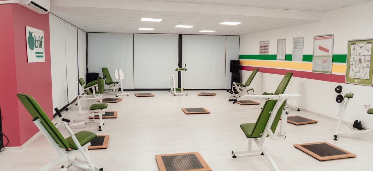 Bright and spacious gym interior featuring modern green exercise machines in Yalova.